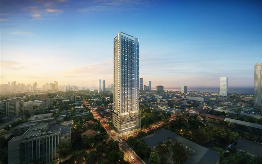 It captures the Torre de Lorenzo Malate building facade while including the entire city's buildings.