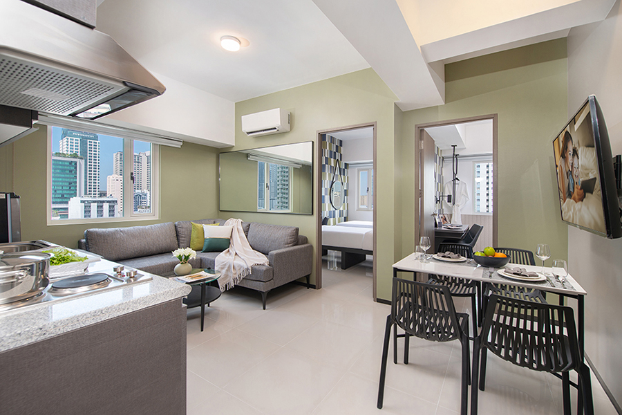 Serviced residences featuring a kitchen and living room.