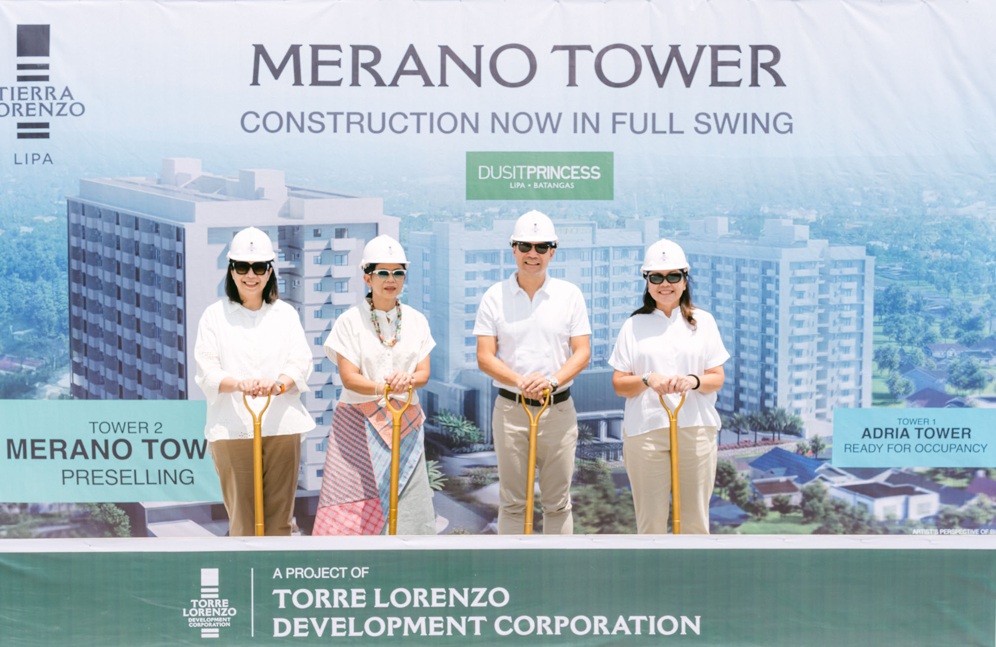 a group of people wearing white shirts and white helmets at the groundbreaking of Merano Tower at Tierra Lorenzo Lipa