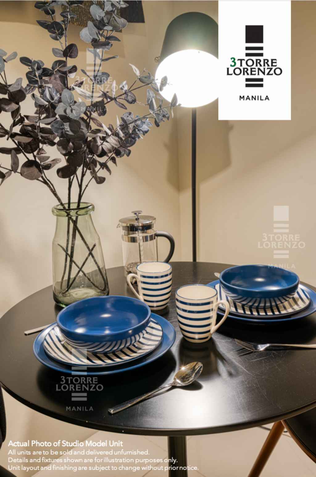 a table with dinnerware set at 3Torre Lorenzo Studio Model Unit
